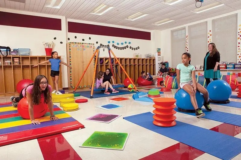 A child practicing fine motor skills with blocks